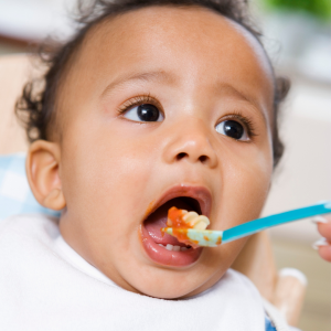 Baby eating spaghetti