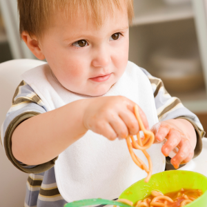 3 year old eating spaghetti