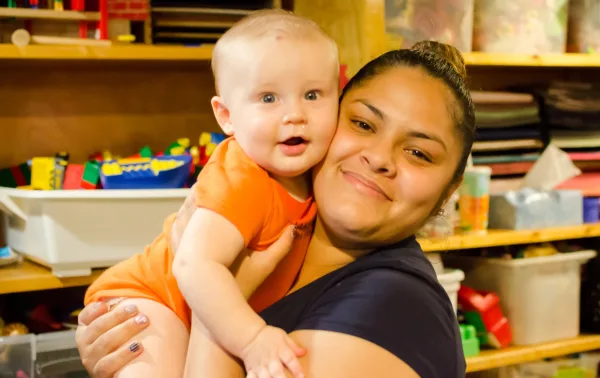 Adult holding a baby