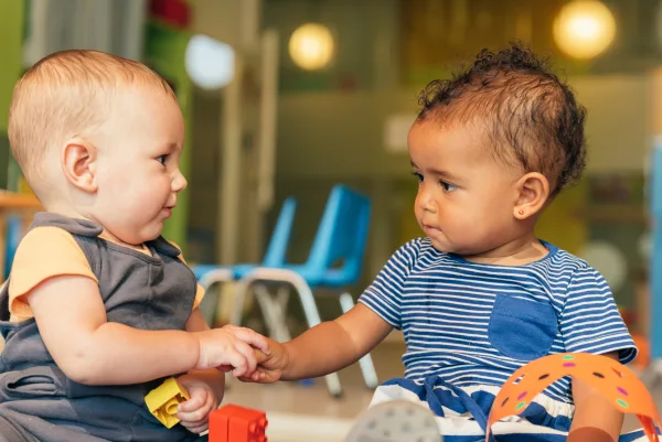 Two babies playing in early learning activities, cognitive development, age appropriate, Indiana Resources