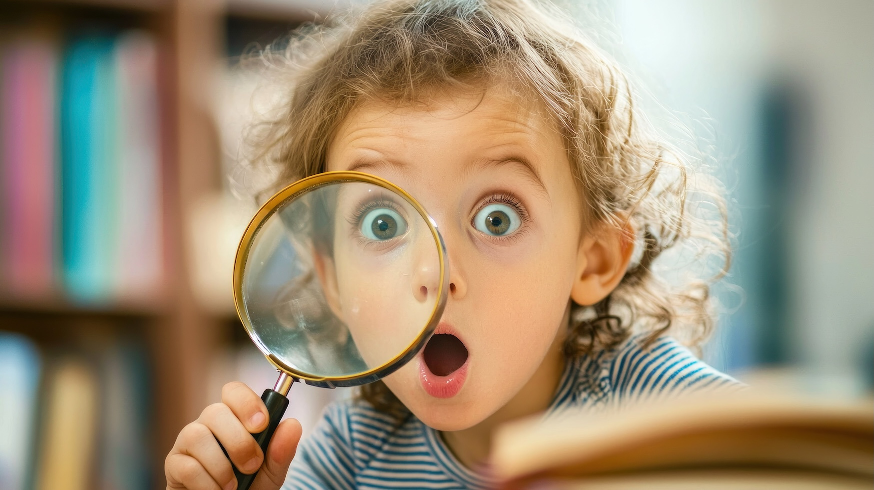 Preschooler with magnifying glass