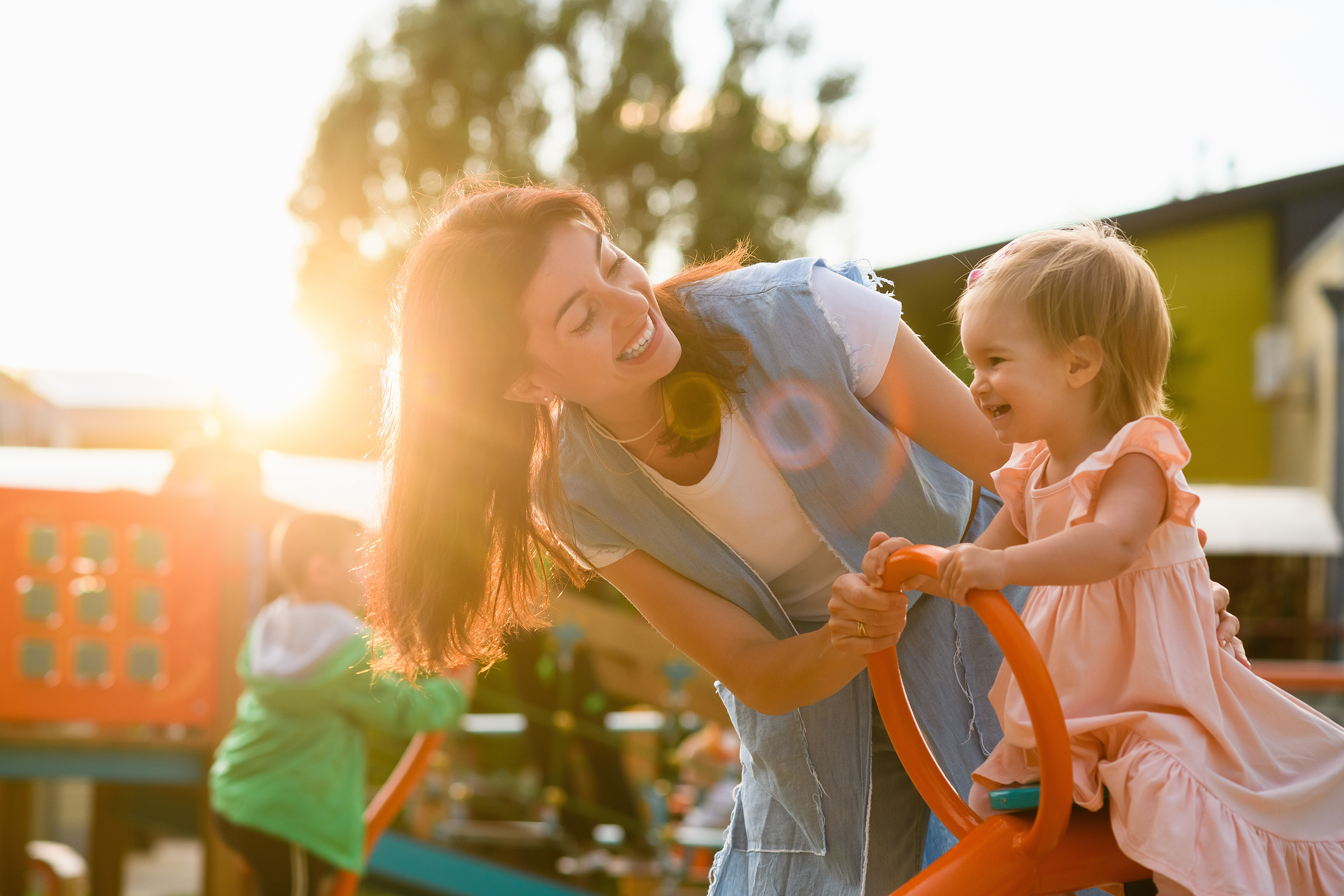 mom with child on playground