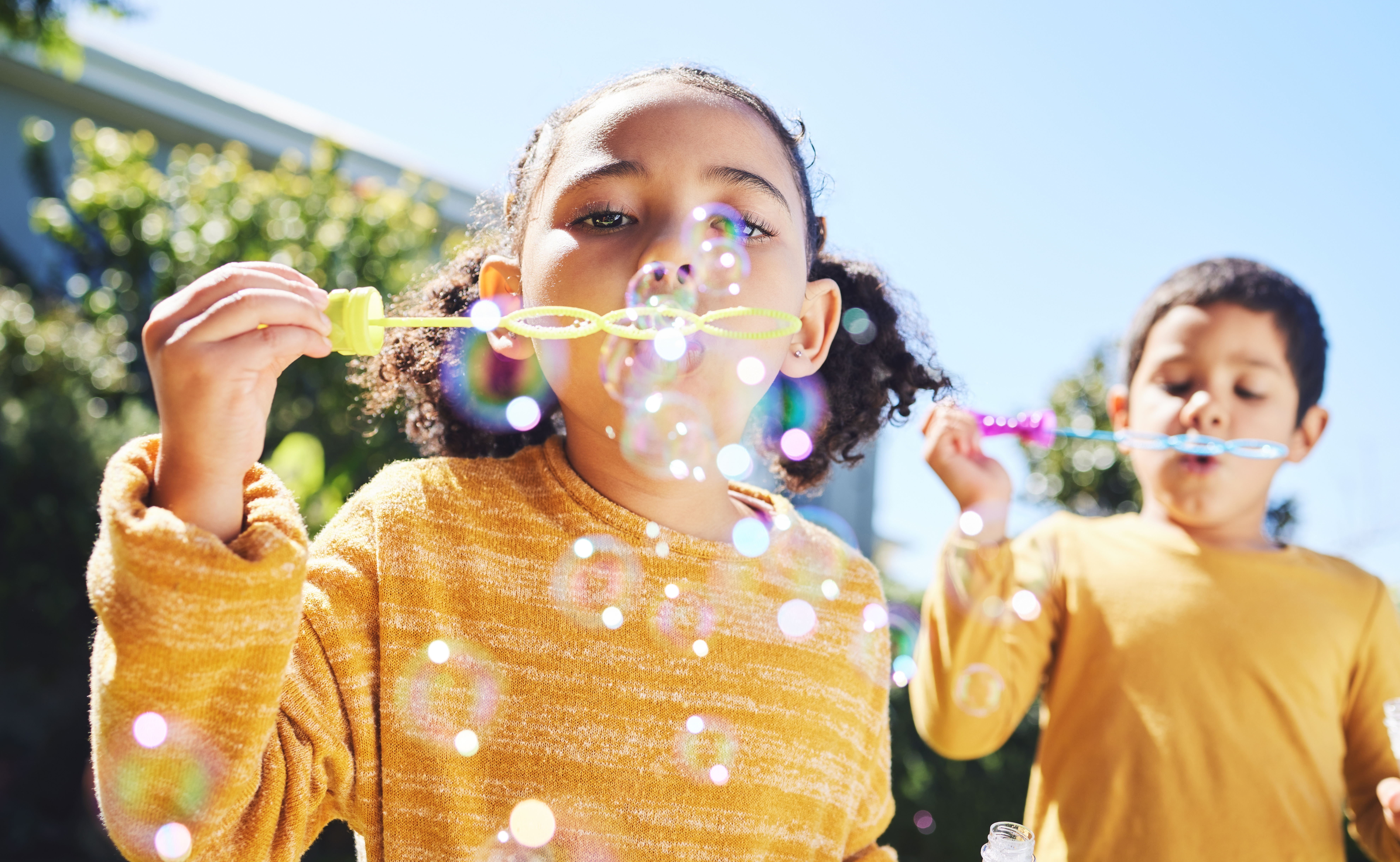 kids blowing bubbles