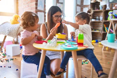 teacher playing with children