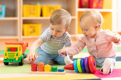 toddlers playing with color sorter