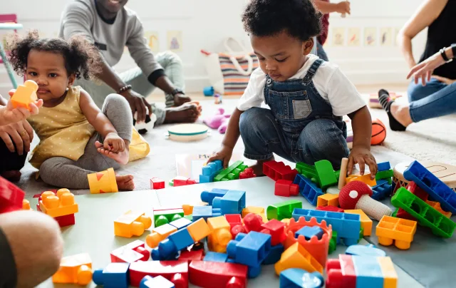 children playing with mega blocks